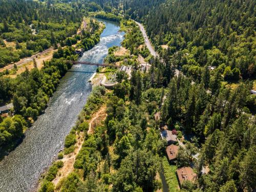 an aerial view of a river and trees at Weasku Inn in Grants Pass