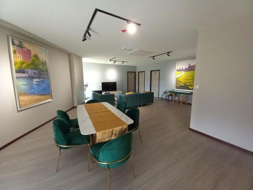 a conference room with a table and chairs in a room at KAN JIA in Miri
