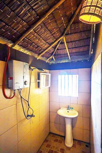 a bathroom with a sink and a toilet at Koh Jum Resort in Ko Jum