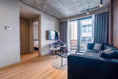 a living room with a couch and a table at TWENTY SIX ANFA LUXURY RESIDENCE by Shortstaymaroc -Hyper Centre -Parking in Casablanca