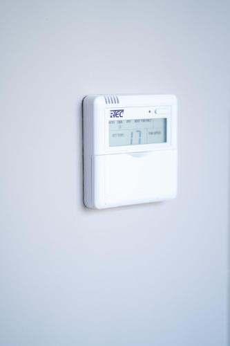an electronic thermometer on a white background at TWENTY SIX ANFA LUXURY RESIDENCE by Shortstaymaroc -Hyper Centre -Parking in Casablanca