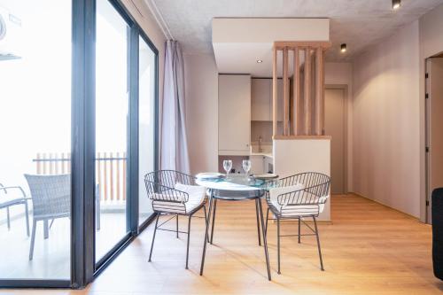a kitchen and dining room with a table and chairs at TWENTY SIX ANFA LUXURY RESIDENCE by Shortstaymaroc -Hyper Centre -Parking in Casablanca
