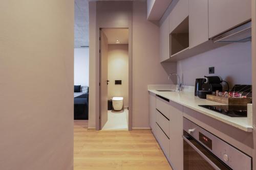 a kitchen with a sink and a toilet in a room at TWENTY SIX ANFA LUXURY RESIDENCE by Shortstaymaroc -Hyper Centre -Parking in Casablanca
