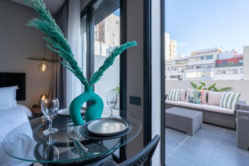 a glass table with a vase on top of it at TWENTY SIX ANFA LUXURY RESIDENCE by Shortstaymaroc -Hyper Centre -Parking in Casablanca