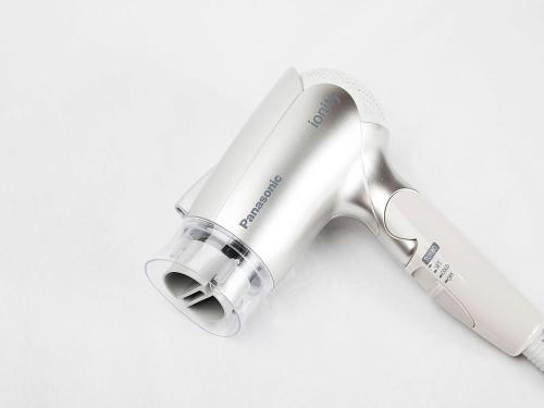 a white electric hair dryer on a white background at Hotel Route Inn Tokushima Airport -Matsushige Smartinter- in Matsushige