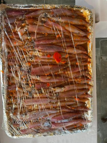 a tray of sausages are wrapped in foil at Full Moon Village Resort in Mui Ne
