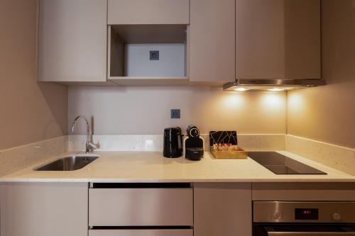 a kitchen with a sink and a counter top at TWENTY SIX ANFA LUXURY RESIDENCE by Shortstaymaroc -Hyper Centre -Parking in Casablanca