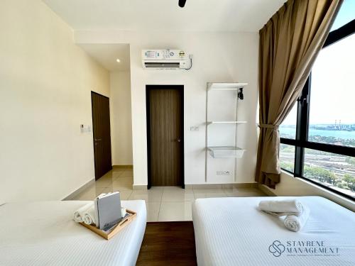 Ένα ή περισσότερα κρεβάτια σε δωμάτιο στο Twin Tower Residence Johor Bahru by Stayrene