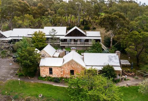 an aerial view of a house with snow covered roofs at Second Valley Cottages and Lodge in Second Valley