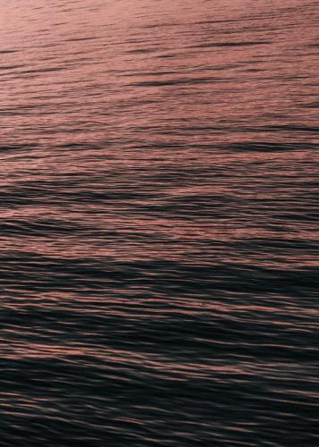 a view of the water at sunset at Anzan Atitlan in San Marcos La Laguna