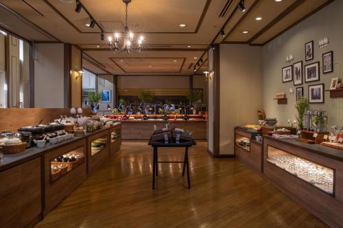 a restaurant with a table in the middle of a room at Hotel Crescent Asahikawa in Asahikawa