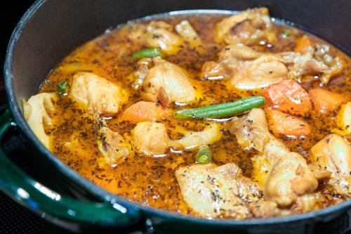 a pot of food with chicken and vegetables at Hotel Crescent Asahikawa in Asahikawa