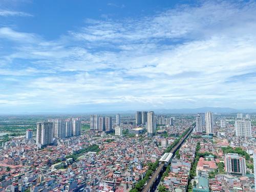 an overhead view of a city with a train at TSQ STAY Hotel Apartment in Hanoi