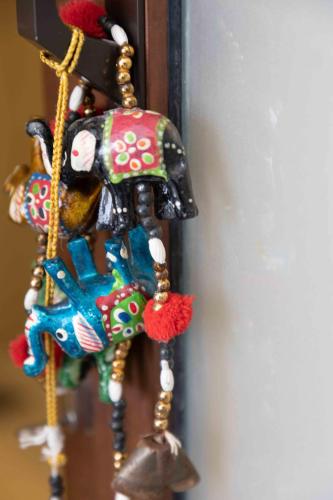 a colorful dream catcher hanging on a door at Lotus Colombo Guesthouse in Colombo