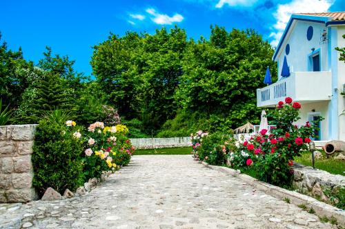 a path in front of a house with flowers at Dreams Apartments - Katelios,Santa Barbara beach in Katelios