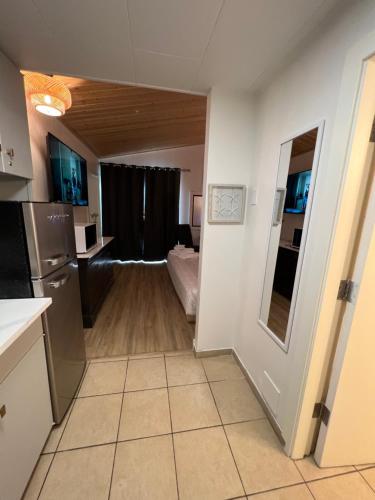 a room with a kitchen and a living room at Destination Inn Cache Creek in Cache Creek