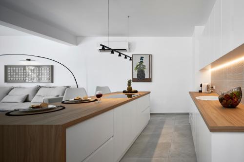 A kitchen or kitchenette at Santorini Hillside Suites & Villas