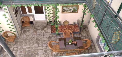 an overhead view of a restaurant with tables and chairs at Nur-Niso Guest House in Bukhara