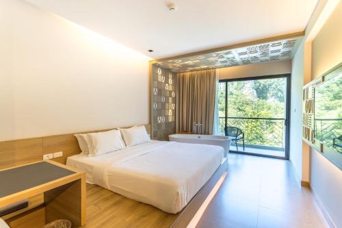 Postel nebo postele na pokoji v ubytování Anana Ecological Resort Krabi - SHA Extra Plus