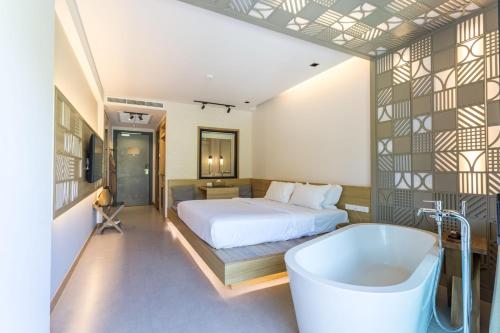 Postel nebo postele na pokoji v ubytování Anana Ecological Resort Krabi - SHA Extra Plus