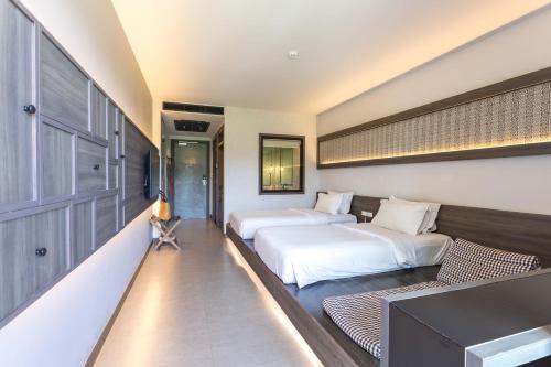 Postel nebo postele na pokoji v ubytování Anana Ecological Resort Krabi - SHA Extra Plus