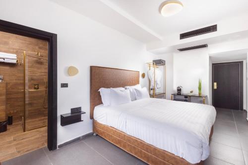מיטה או מיטות בחדר ב-מלון בוטיק H34
