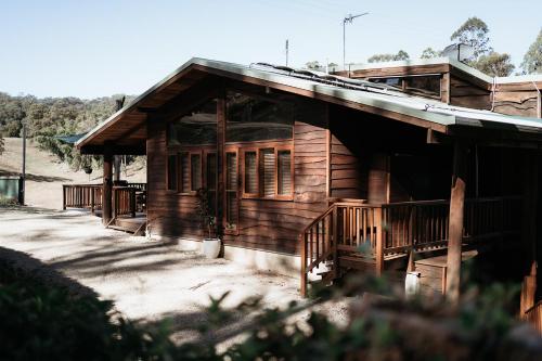 an old wooden house with a porch and a porch at Bellingdale Farm in Clothiers Creek