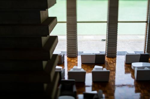 a view of a room with chairs and windows at River Retreat Garaku in Toyama