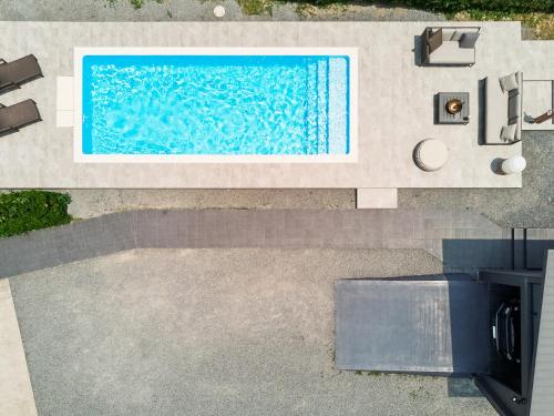 an overhead view of a swimming pool in a house at CAP MARTIN Funny house in Kyonan