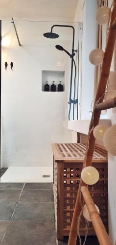 a room with white walls and a staircase with black objects at B&B La Mimosa in Teguise