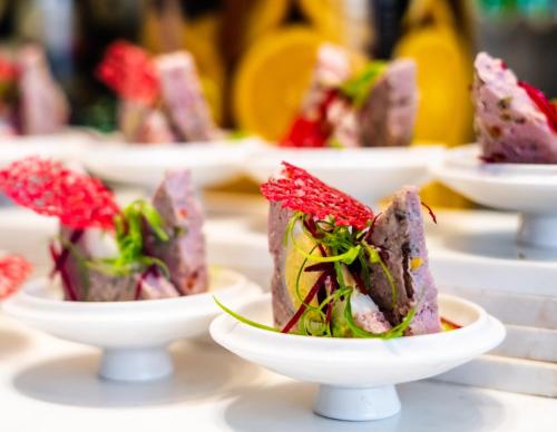 a row of plates of food on a table at JW Marriott Pune in Pune