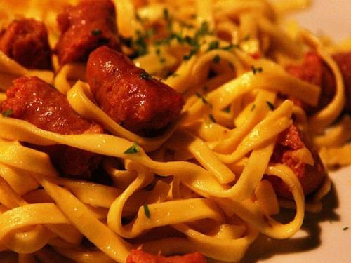 a plate of pasta with meatballs and cheese at Agriturismo Al Marnich in Schignano