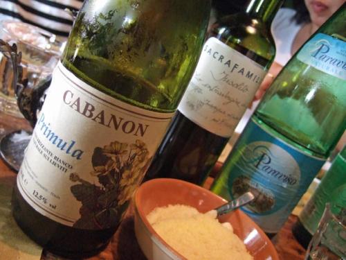 two bottles of wine and a bowl of cheese at Agriturismo Al Marnich in Schignano