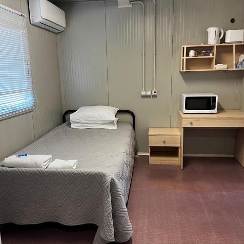 Postel nebo postele na pokoji v ubytování Jambin hotel motel
