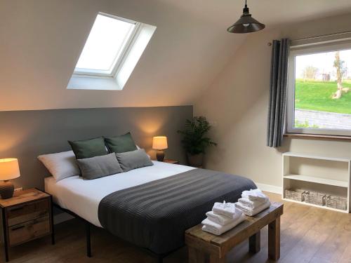 a bedroom with a bed and a window at Sandyhill Guest House - Westport in Westport