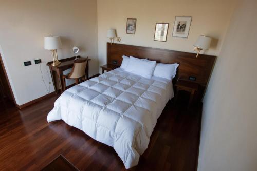 Ένα ή περισσότερα κρεβάτια σε δωμάτιο στο Hotel Conteverde