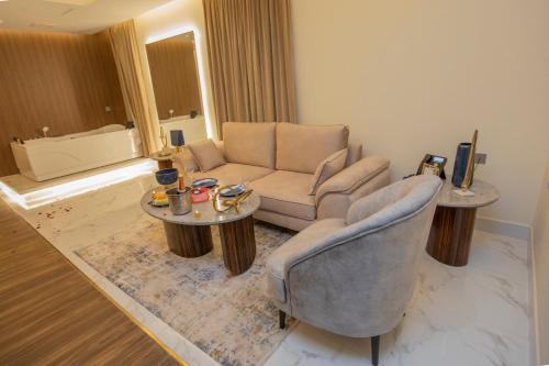 a living room with a couch and a table and chairs at Luxury Night Al Mounisea in Riyadh