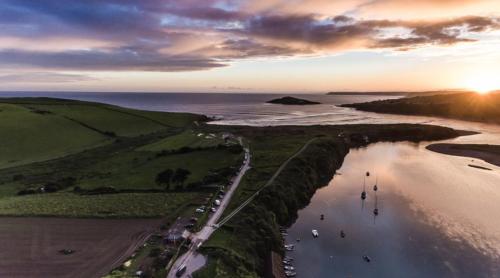 an aerial view of a beach with boats in the water at Island View at White Horses, Bantham, South Devon - with glorious sea views in Bantham