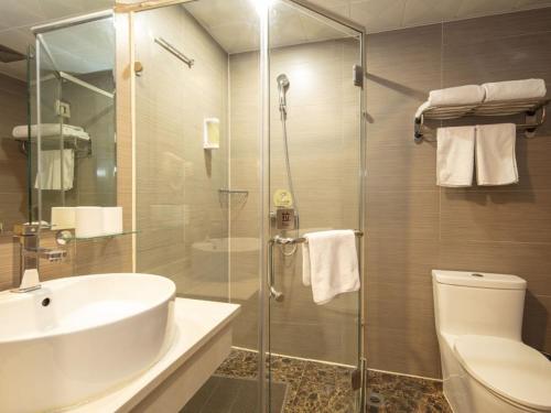 a bathroom with a shower and a sink and a toilet at GreenTree Alliance Jiangsu Huai'an Suning Plaza in Huai'an