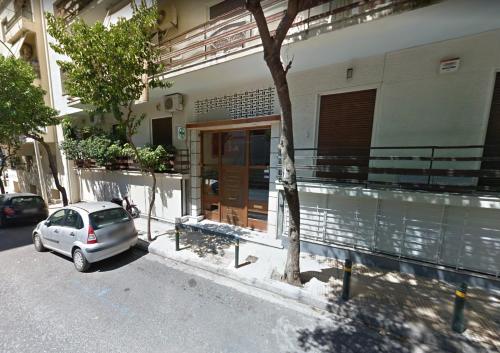 a small car parked in front of a house at Chic and Minimal apartment close to Thissio Metro in Athens