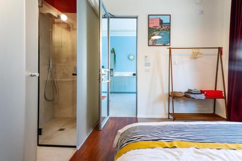 a bedroom with a shower and a bed at My TLV City suite in Tel Aviv