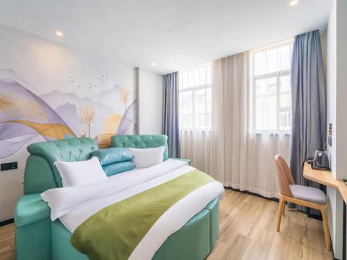 Ένα ή περισσότερα κρεβάτια σε δωμάτιο στο GreenTree Inn Express Hotel Tongcheng Xindu North Xin'an Road