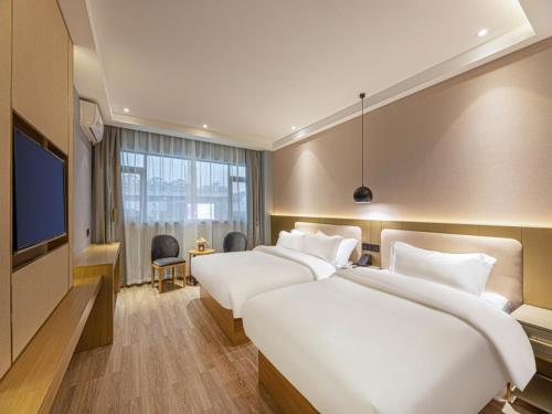 Postel nebo postele na pokoji v ubytování Gya Hotel Suzhou Hanshan Temple Binhe Road