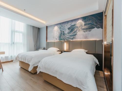 Katil atau katil-katil dalam bilik di GreenTree Inn Jiangsu Yancheng Dongtai Overseas