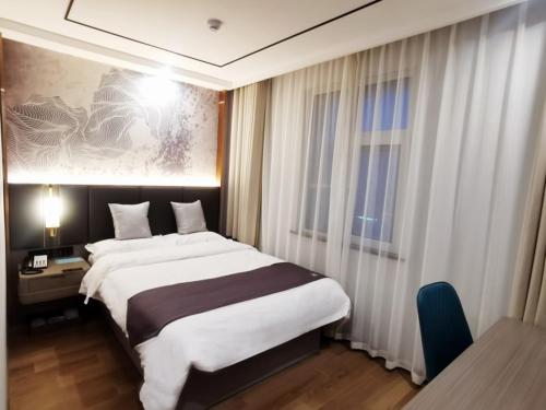 Postel nebo postele na pokoji v ubytování GreenTree Eastern Hotel Huai'an University