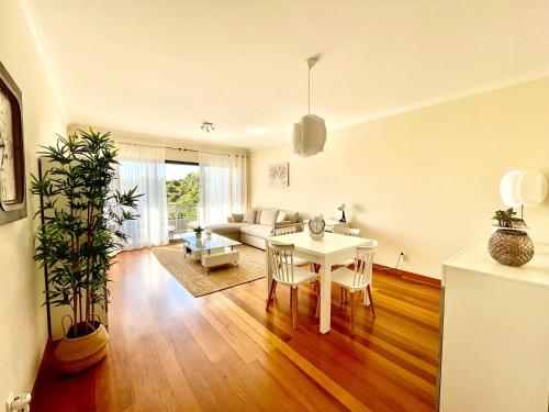 a living room with a table and a couch at Plaza Charming Flat in Santa Cruz