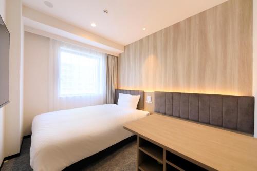Cama o camas de una habitación en Via Inn Prime Sapporo Odori