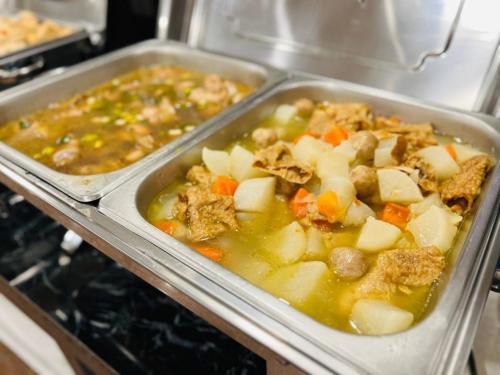 two trays of food in an oven at YUAI FU HAO Hotel in Taichung