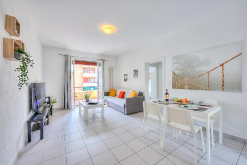 a living room with a table and a couch at Central Love - Happy Rentals in Lugano