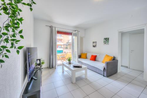 a living room with a couch and a table at Central Love - Happy Rentals in Lugano